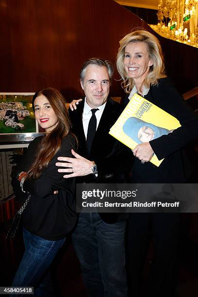 Olivier Lapidus, his wife Yara and Laura Restelli attend Jean-Daniel Lorieux signs his Book 'Sunstroke' at the Art Bookshop of the 'Royal Monceau -...