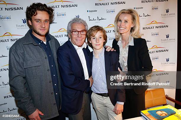Jean-Daniel Lorieux , his companion Laura Restelli with sons Nicolas and Alexandre attend Jean-Daniel Lorieux signs his Book 'Sunstroke' at the Art...