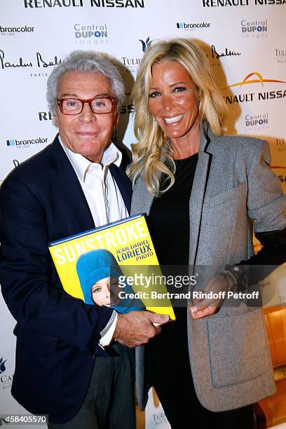 Jean-Daniel Lorieux and Ophelie Winter attend Jean-Daniel Lorieux signs his Book 'Sunstroke' at the Art Bookshop of the 'Royal Monceau - Raffles...