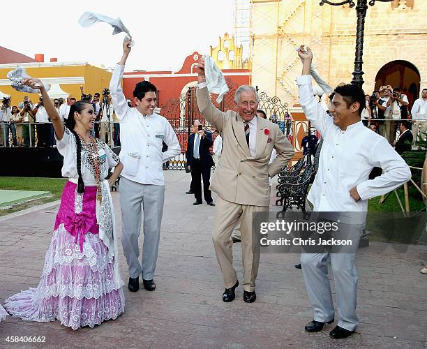 Prince Charles, Prince of Wales takes part in traditional Mexican clog dancing in Zocalo Square on November 4, 2014 in Campeche, Mexico. The Royal...