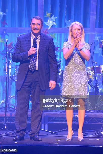 Nigel Mansell and Clea Newman on stage at the second annual SeriousFun Network Gala at at The Roundhouse on November 4, 2014 in London, England.