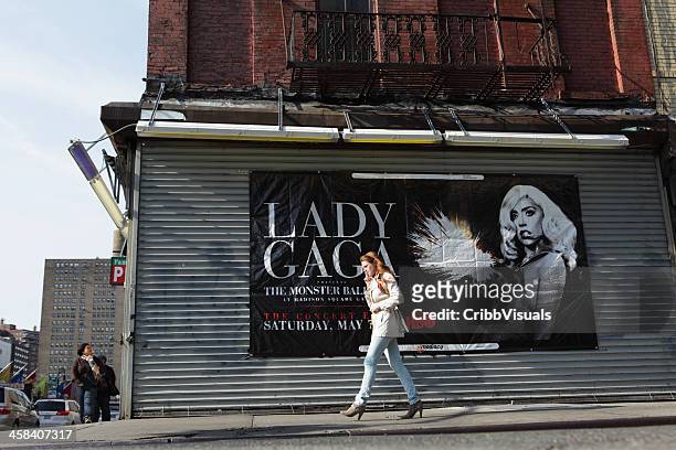 lady gaga advertising banner lower east side nyc - industrial doors stock pictures, royalty-free photos & images