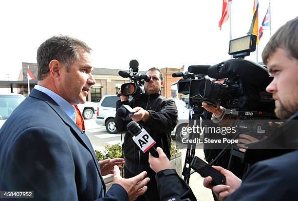 Democratic Senate Candidate Bruce Braley talks with reporters after he escorted his 85-year-old mother Marcia Braley to the polling station November...