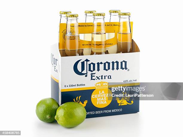 six pack of corona beer with limes - corona beer stockfoto's en -beelden