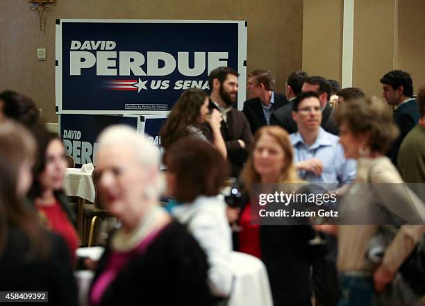 Supporters of Republican U.S. Senate candidate David Perdue gather at his election party at the the InterContinental Buckhead on November 4, 2014 in...