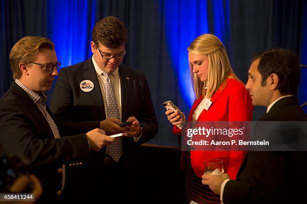 Supporters of U.S. Sen. Mitch McConnell await voting returns at his election night event November 4, 2014 in Louisville, Kentucky. McConnell went on...