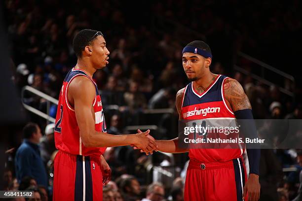 Otto Porter Jr. #22 of the Washington Wizards and Glen Rice Jr. #14 shake hands during a game against the New York Knicks at Madison Square Garden in...