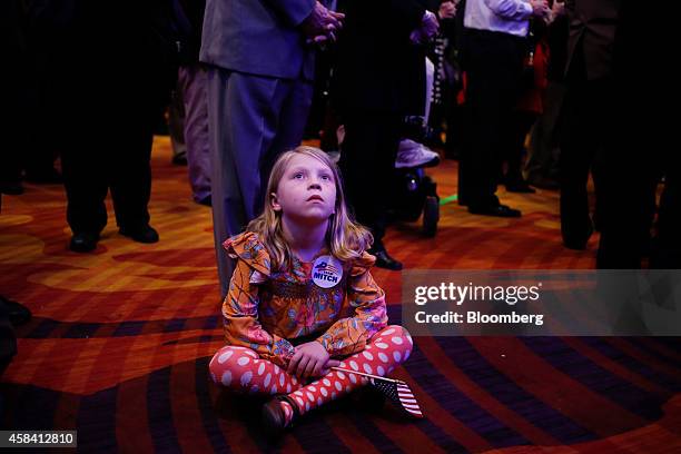 Annie Coleman from Washington, D.C., watches election results at a Republican Party of Kentucky election night party in Louisville, Kentucky, U.S.,...