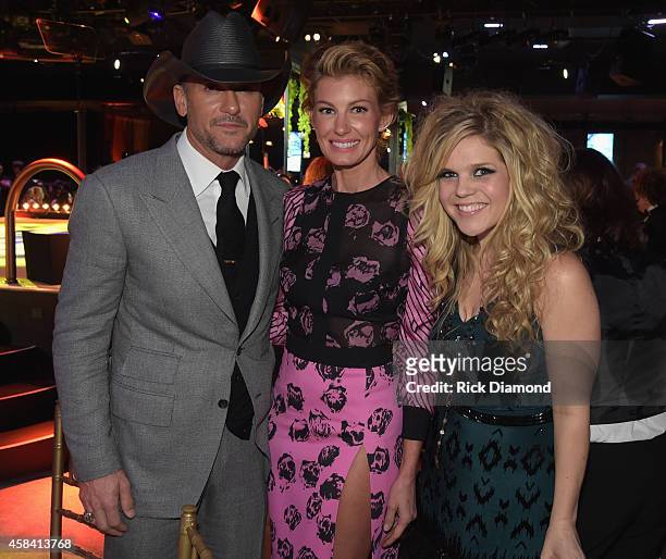 Tim McGraw and Faith Hill pose with Natalie Stovall at the BMI 2014 Country Awards at BMI on November 4, 2014 in Nashville, Tennessee.