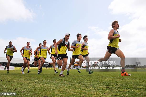 Sebastian Ross leads as players sprint half a lap during a St.Kilda Saints AFL training session at Linen House Oval on November 5, 2014 in Melbourne,...