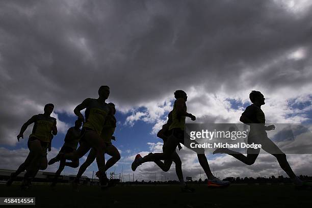 Sebastian Ross leads as players sprint half a lap during a St.Kilda Saints AFL training session at Linen House Oval on November 5, 2014 in Melbourne,...