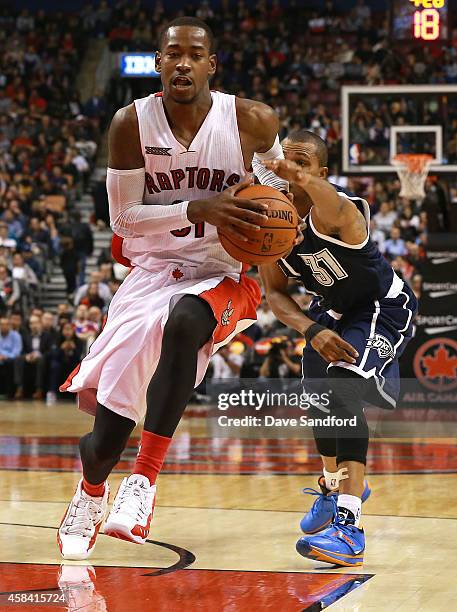 Terrence Ross of the Toronto Raptors drives to the basket past a defending Sebastian Telfair of the Oklahoma City Thunder during their game at Air...