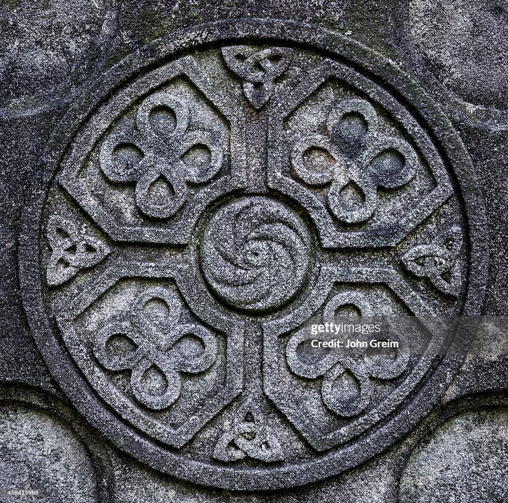 Celtic cross detail with knot symbol designs...