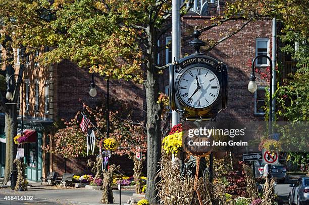 Town clock with autumn decorations.