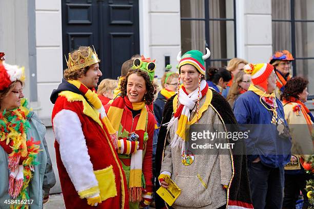 colorful people watching the annual carnival parade in 's hertogenbosch - fiesta of san fermin stockfoto's en -beelden