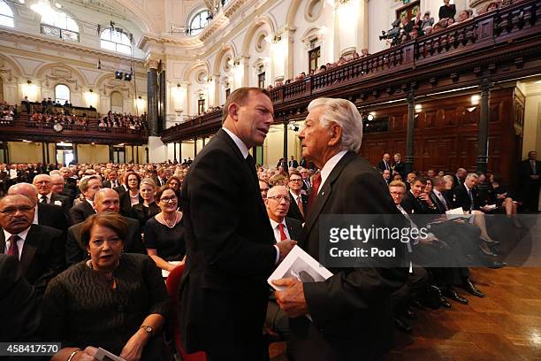 Australian Tony Abbott and former Prime Minister Bob Hawke shake hands at the state memorial service for former Australian Prime Minister Gough...