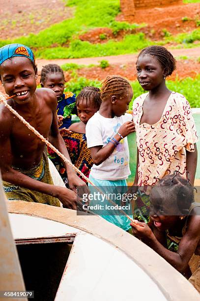 plenty of water - african africa child drinking water cup stock pictures, royalty-free photos & images