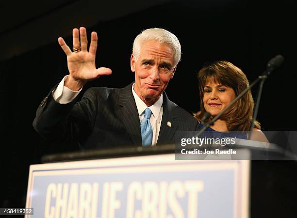 Former Florida Governor and Democratic gubernatorial candidate Charlie Crist waves as he stands with Annette Taddeo, his Democratic lieutenant...