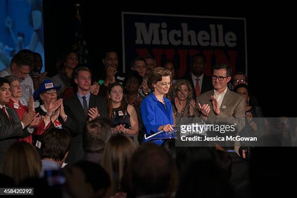 Georgia Democratic U.S. Senate candidate Michelle Nunn with husband, Ron Martin , makes a concession speech to supporters gathered at the Hyatt...