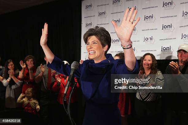 Republican U.S. Senate candidate Joni Ernst takes the stage on election night after being projected as the winner at the Marriott Hotel November 4,...