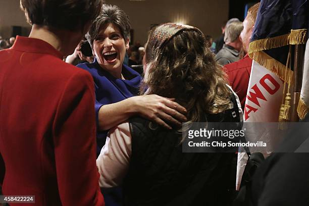 Republican U.S. Senator-elect Joni Ernst embraces and thanks her family after she won the U.S. Senate race on election night at the Marriott Hotel...