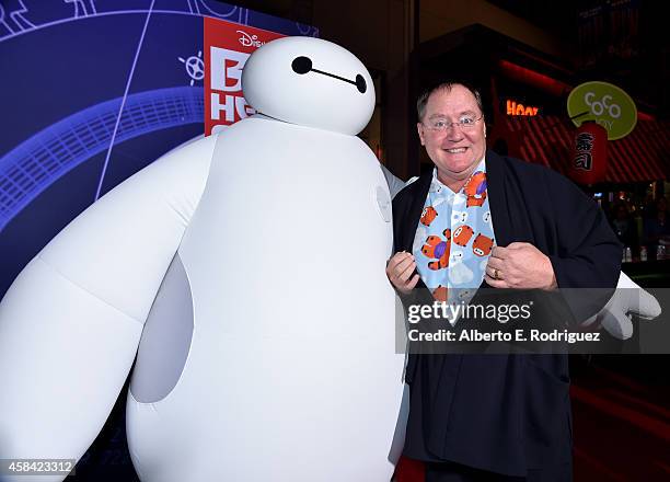 Chief Creative Officer at Pixar, Walt Disney Animation Studios and DisneyToon Studios John Lasseter with character Baymax attends the Los Angeles...