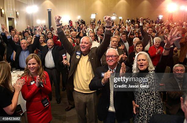 Supporters of Republican U.S. Senate candidate David Perdue react as Perdue wins the election at the InterContinental Buckhead November 4, 2014 in...