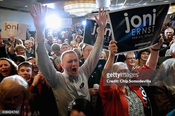 Supporters celebrate after hearing that Republican candidate Joni Ernst won the U.S. Senate race on election night at the Marriott Hotel November 4,...