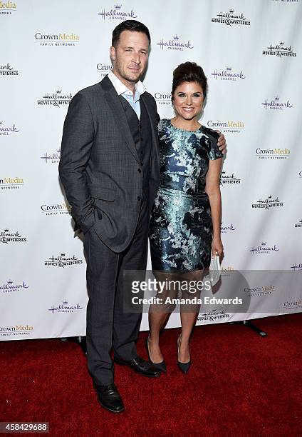Actress Tiffani Thiessen and her husband, actor Brady Smith arrive at the Hallmark Channel's Holiday Christmas world premiere screening of...