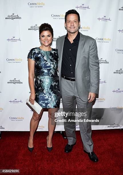 Actress Tiffani Thiessen and actor Josh Hopkins arrive at the Hallmark Channel's Holiday Christmas world premiere screening of "Northpole" at La...