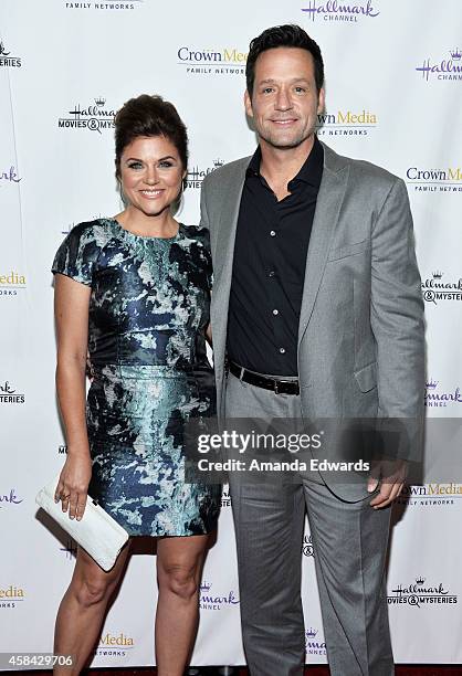 Actress Tiffani Thiessen and actor Josh Hopkins arrive at the Hallmark Channel's Holiday Christmas world premiere screening of "Northpole" at La...