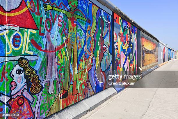 east side gallery wall of berlin germany - berlin graffiti stock pictures, royalty-free photos & images