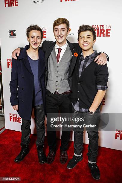 Nicholas Coombe, Joshua Ballard and Bradley Steven Perry arrive to the Disney XD "Pants On Fire" premiere on November 4, 2014 in Hollywood,...