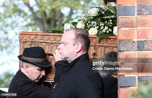 Jack Bruce coffin is carried in to the Crematorium by his son Malcolm Bruce at the funeral of Jack Bruce at Golders Green Crematorium on November 5,...