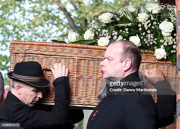 Jack Bruce coffin is carried in to the Crematorium by his son Malcolm Bruce at the funeral of Jack Bruce at Golders Green Crematorium on November 5,...