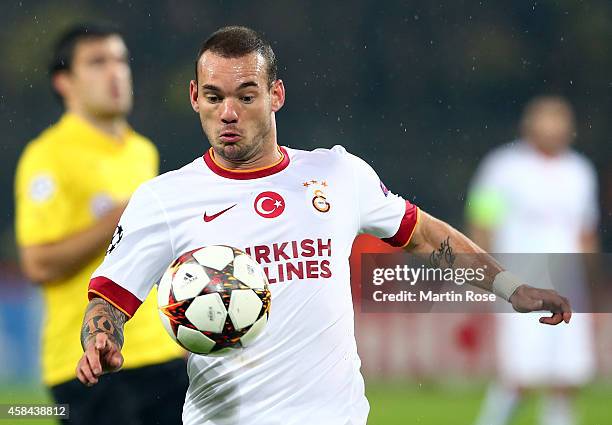 Wesley Sneijder of Galatasaray runs with the ball during the UEFA Champions League Group D match between Borussia Dortmund and Galatasaray AS at...