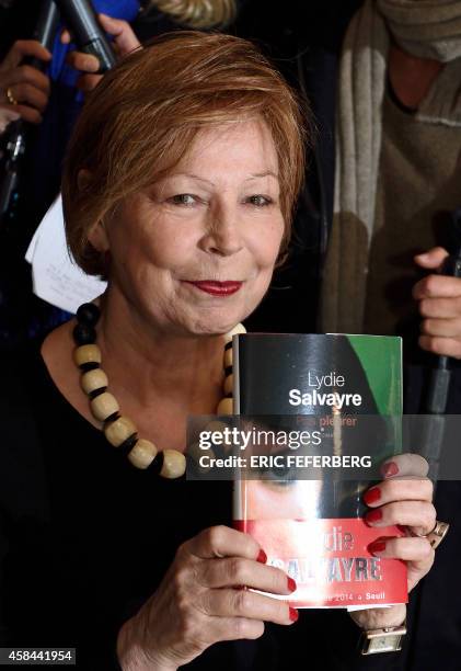 French writer Lydie Salvayre poses after being awarded with France's top literary prize, the Goncourt 2014, for her novel "Pas pleurer", on November...