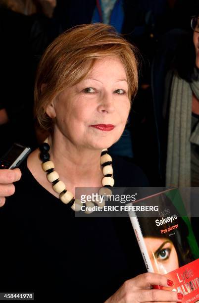 French writer Lydie Salvayre poses after being awarded with France's top literary prize, the Goncourt 2014, for her novel "Pas pleurer", on November...