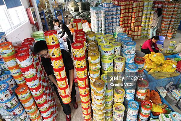 Staffs of an e-commerce store prepare goods for Singles' Day Discounts on November 5, 2014 in Wenzhou, Zhejiang province of China. Online shopping...