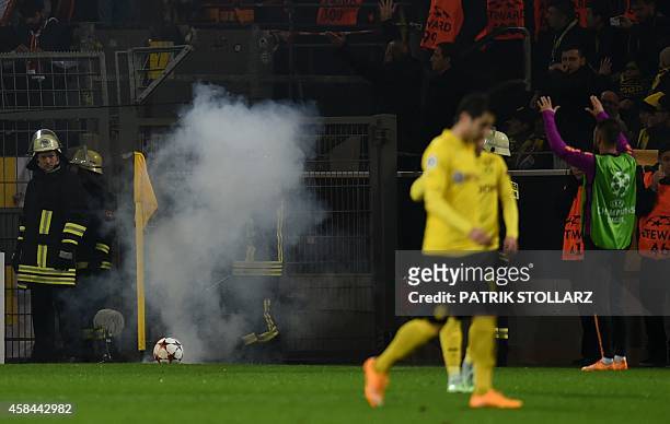 Galatasaray´s supporters burn fireworks during the UEFA Champions League second-leg Group D football match Borussia Dortmund vs Galatasaray AS in...