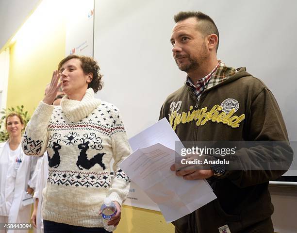 Spanish nurse Teresa Romero salutes audiences during a press release before she leaves Carlos III Hospital after being discharged in Madrid, Spain on...