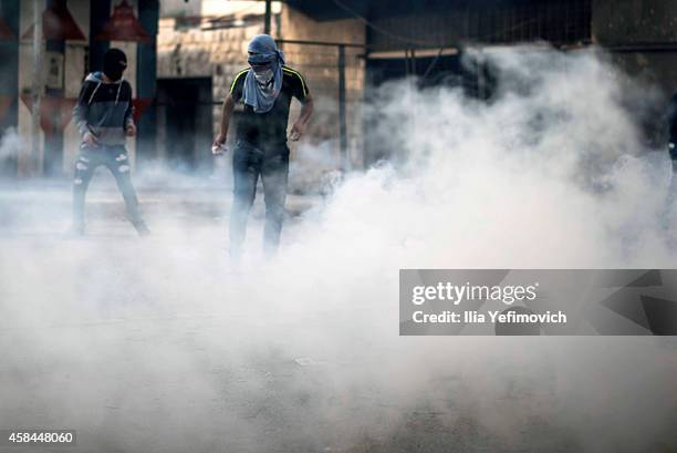 Palestinian youth clash with police at Shuafat refugee camp after a Palestinian resident of the camp was named as the driver of a van that rammed...