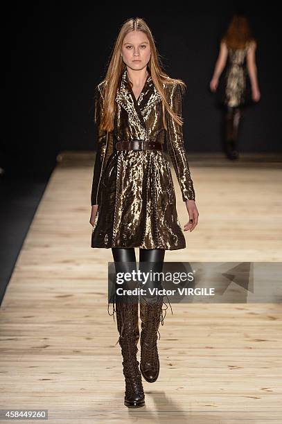 Model walks the runway at the Tufi Duek fashion show during Sao Paulo Fashion Week Winter 2015 at Parque Candido Portinari on November 3, 2014 in Sao...