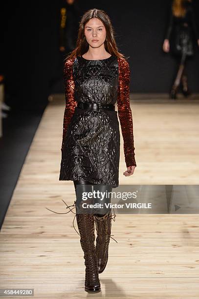 Model walks the runway at the Tufi Duek fashion show during Sao Paulo Fashion Week Winter 2015 at Parque Candido Portinari on November 3, 2014 in Sao...