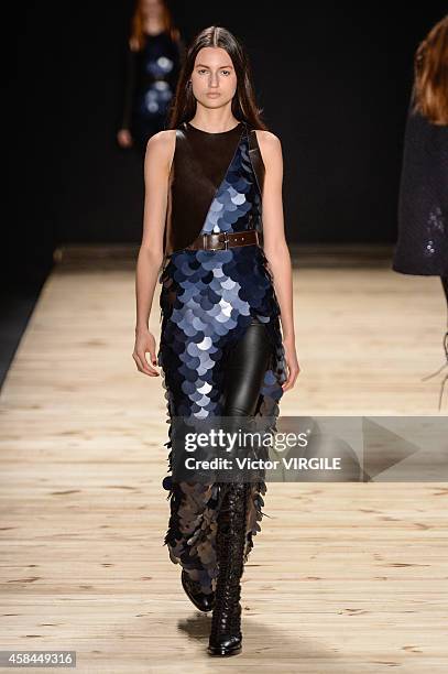 Model walks the runway at the Tufi Duek fashion show during Sao Paulo Fashion Week Winter 2015 at Parque Candido Portinari on November 3, 2014 in Sao...