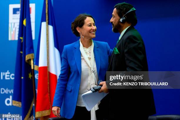 French minister for Ecology, Sustainable Development and Energy Segolene Royal congratulates the head of the UN's climate science panel Rajendra...