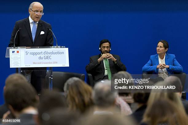 French Foreign Affairs minister Laurent Fabius speaks next to the head of the UN's climate science panel Rajendra Pachauri and French minister for...