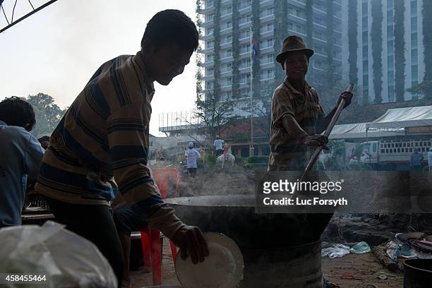 Cooks prepare breakfast for racing boat crews on the first morning of the Water Festival on November 5, 2014 in Phnom Penh, Cambodia. Two million...