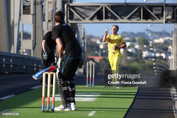 Andy Bichel bowls to Stephen Fleming on Auckland's Harbour Bridge, marking 100 days to go until the ICC Cricket World Cup 2015 which takes place in...