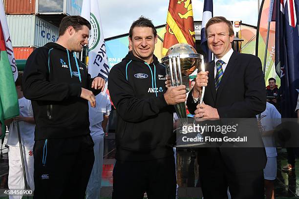 Minister of Sport Jonathan Coleman holding the 2015 Cricket World Cup and with Black Caps Nathan McCullum and Mitchell McClenaghan during the 100 day...